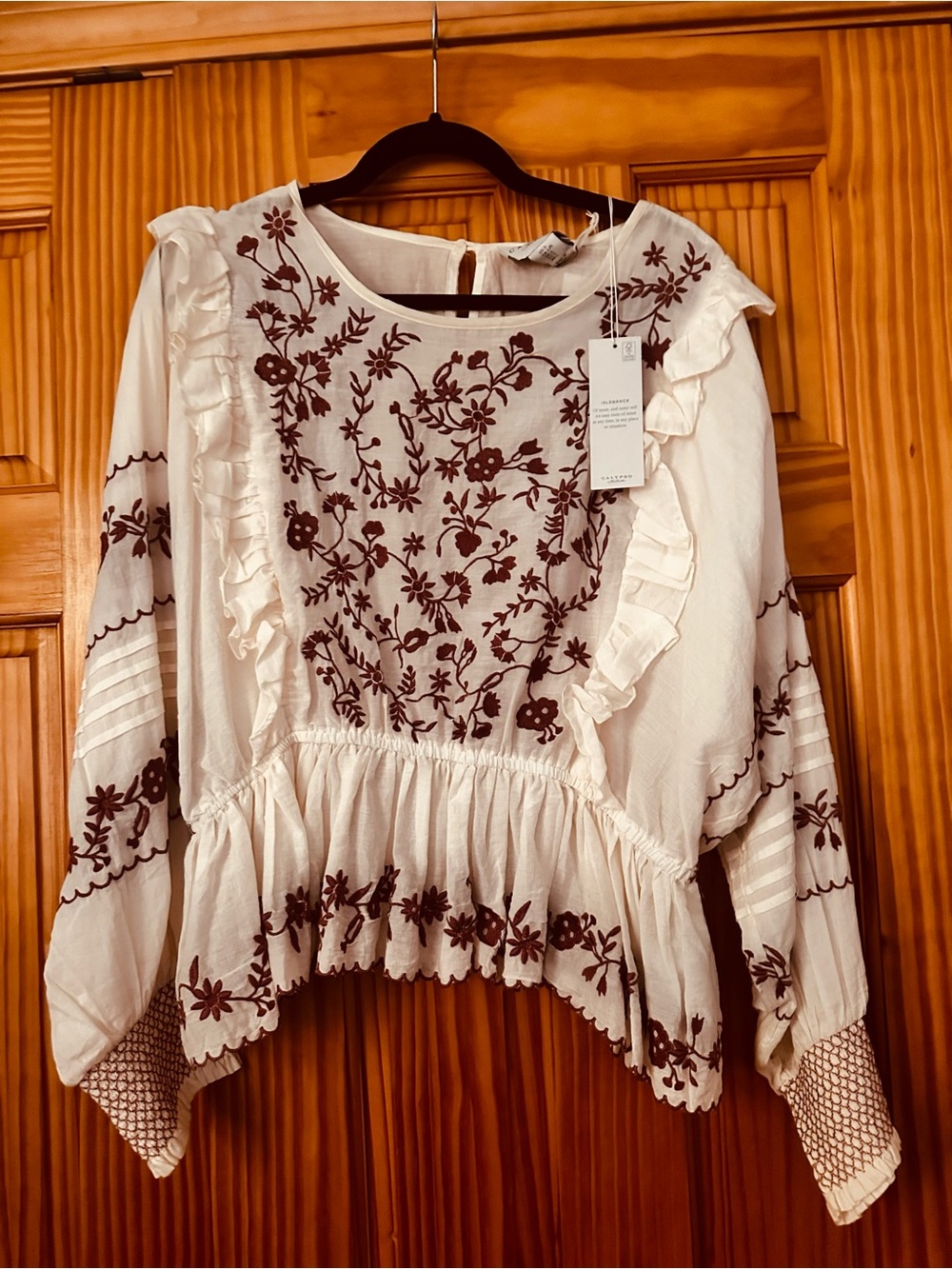 Women’s Embroidered Ruffle Peplum Top - White with rust color Floral